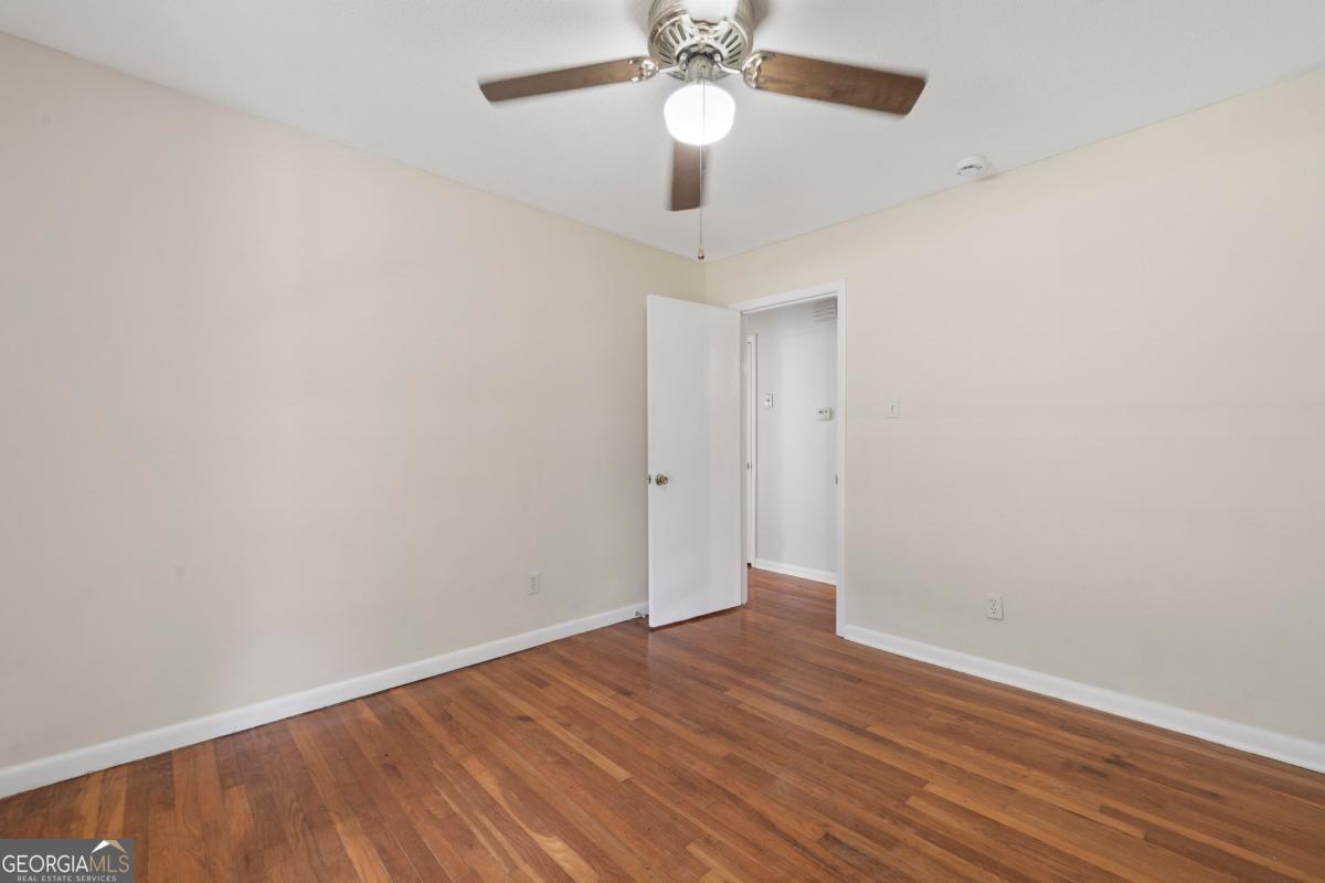 3021 Penfield Road Greensboro, GA 30642 - Photo 31 of 50 wooden floor in an empty room