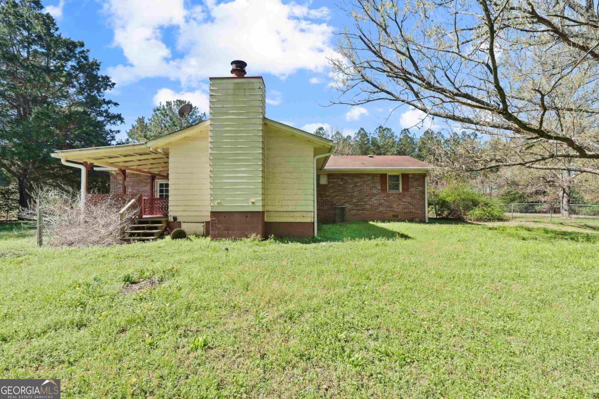 3021 Penfield Road Greensboro, GA 30642 - Photo 7 of 50 a view of a backyard of the house