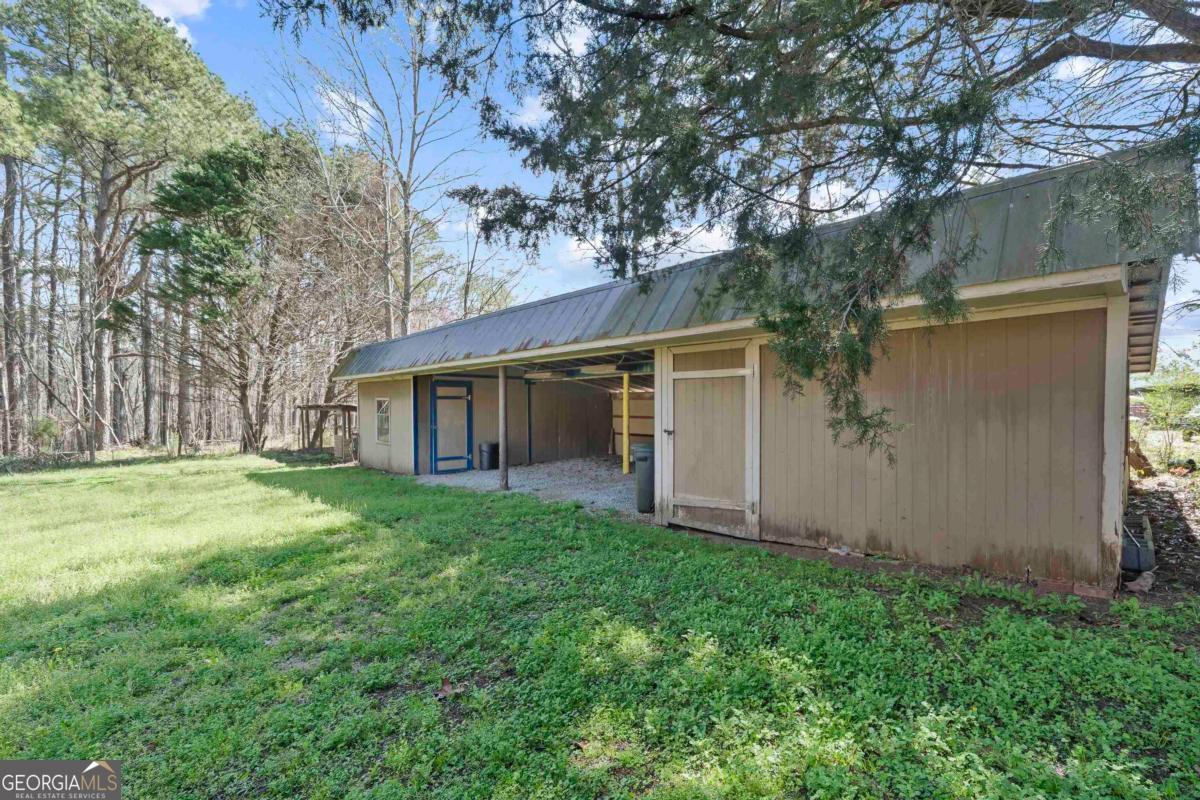 3021 Penfield Road Greensboro, GA 30642 - Photo 9 of 50 front view of a house with a yard