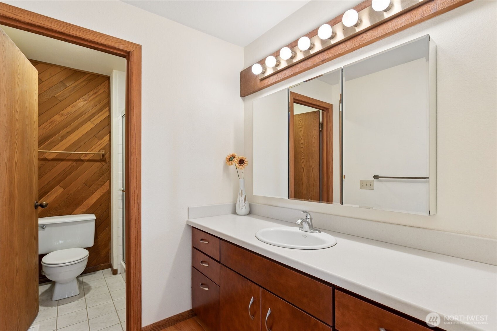 5019 East Mercer Way Mercer Island, WA 98040 - Photo 14 of 31 a bathroom with a toilet a sink and mirror