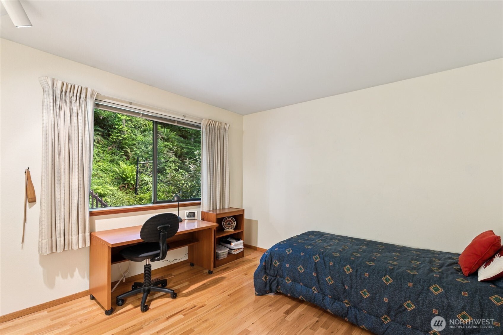 5019 East Mercer Way Mercer Island, WA 98040 - Photo 16 of 31 a bedroom with a bed and wooden floor