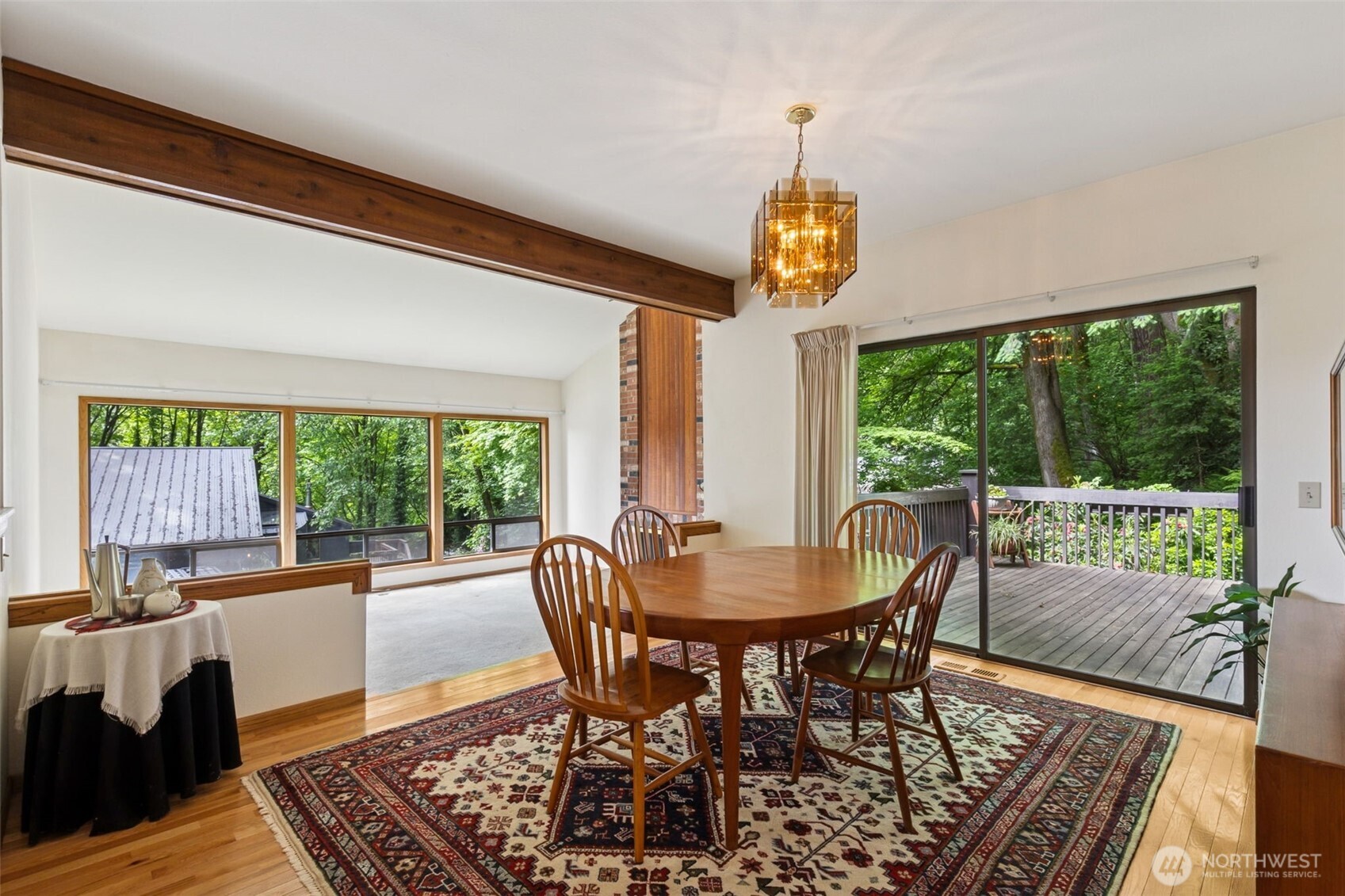 5019 East Mercer Way Mercer Island, WA 98040 - Photo 3 of 31 a view of a dining room with furniture window and outside view