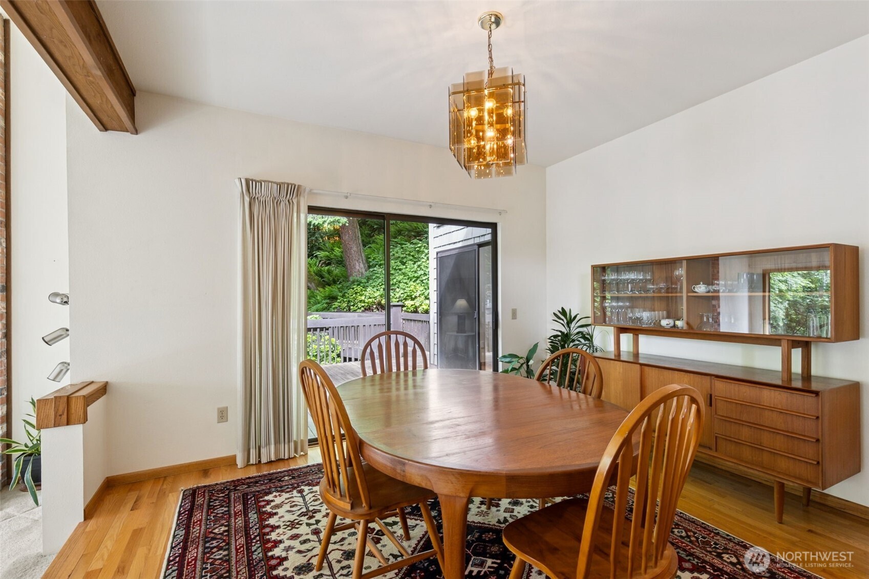 5019 East Mercer Way Mercer Island, WA 98040 - Photo 4 of 31 a view of a dining room with furniture window and wooden floor