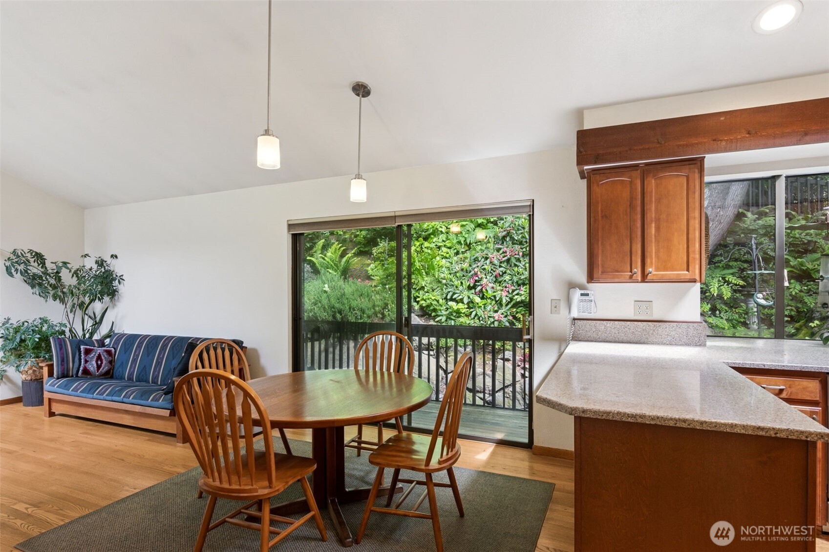5019 East Mercer Way Mercer Island, WA 98040 - Photo 6 of 31 a view of a dining room with furniture window and outside view