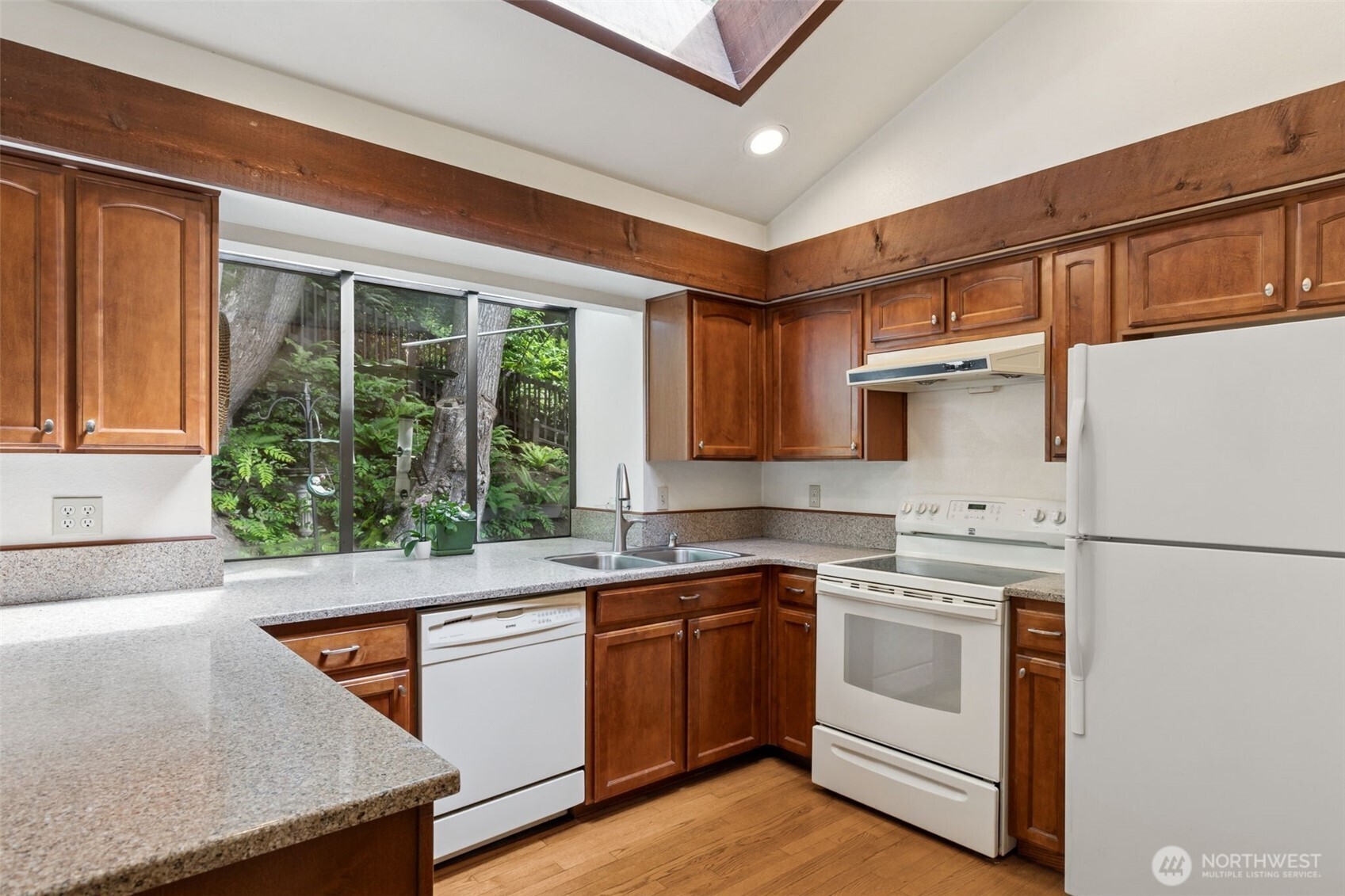 5019 East Mercer Way Mercer Island, WA 98040 - Photo 8 of 31 a kitchen with white cabinets and white appliances
