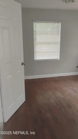 a view of a room that has a window in it