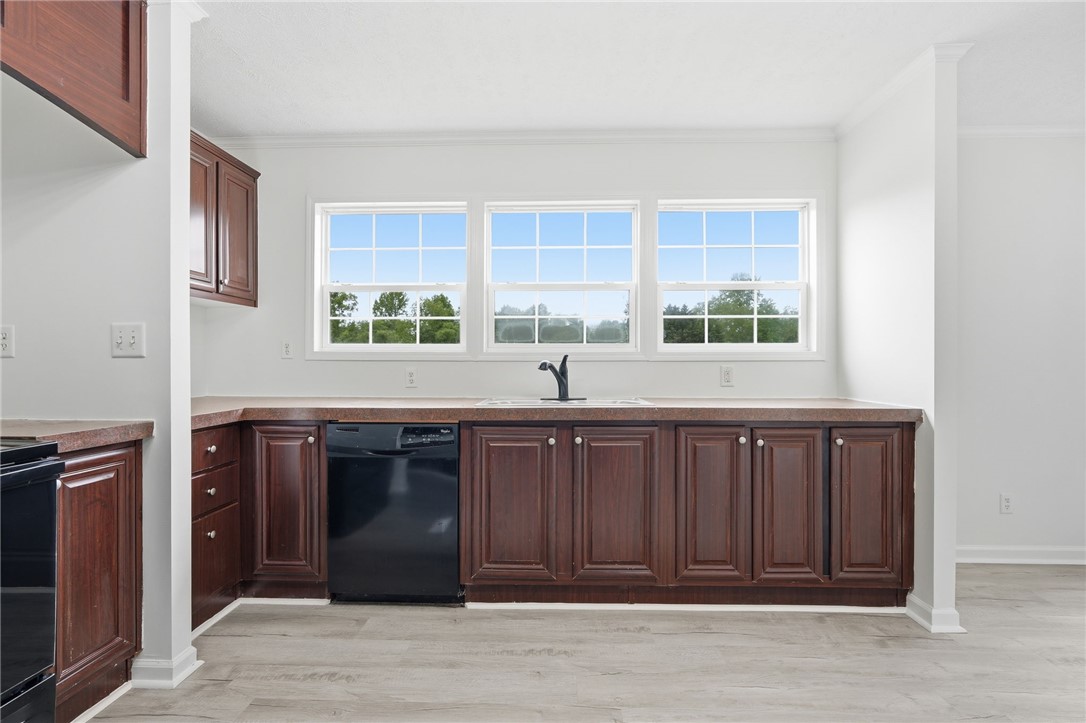 112 Sir Francis Drake Way Liberty, SC 29657 - Photo 34 of 42 This bright kitchen offers ample cabinetry, a functional sink, and a view of the outdoors.