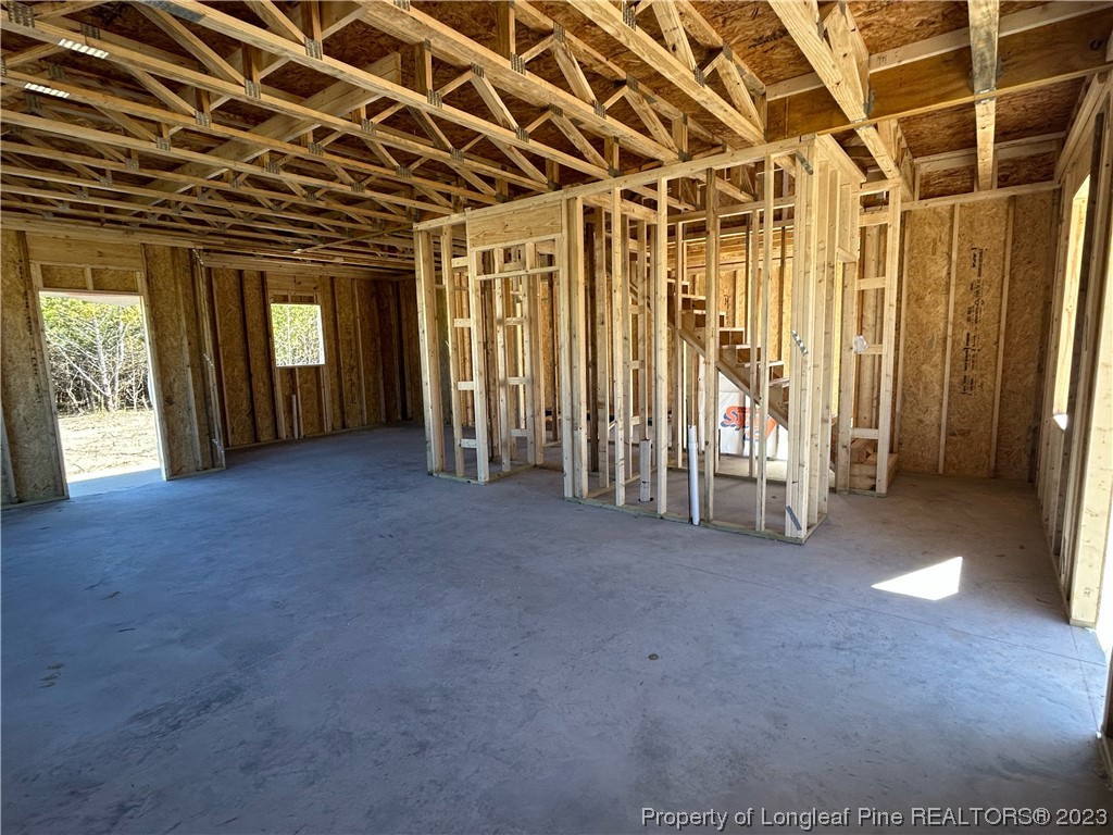 325 Ray Byrd Road Lillington, NC 27546 - Photo 11 of 23 a view of empty room with wooden walls