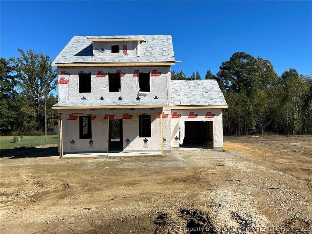 325 Ray Byrd Road Lillington, NC 27546 - Photo 2 of 23 a front view of a house with a yard