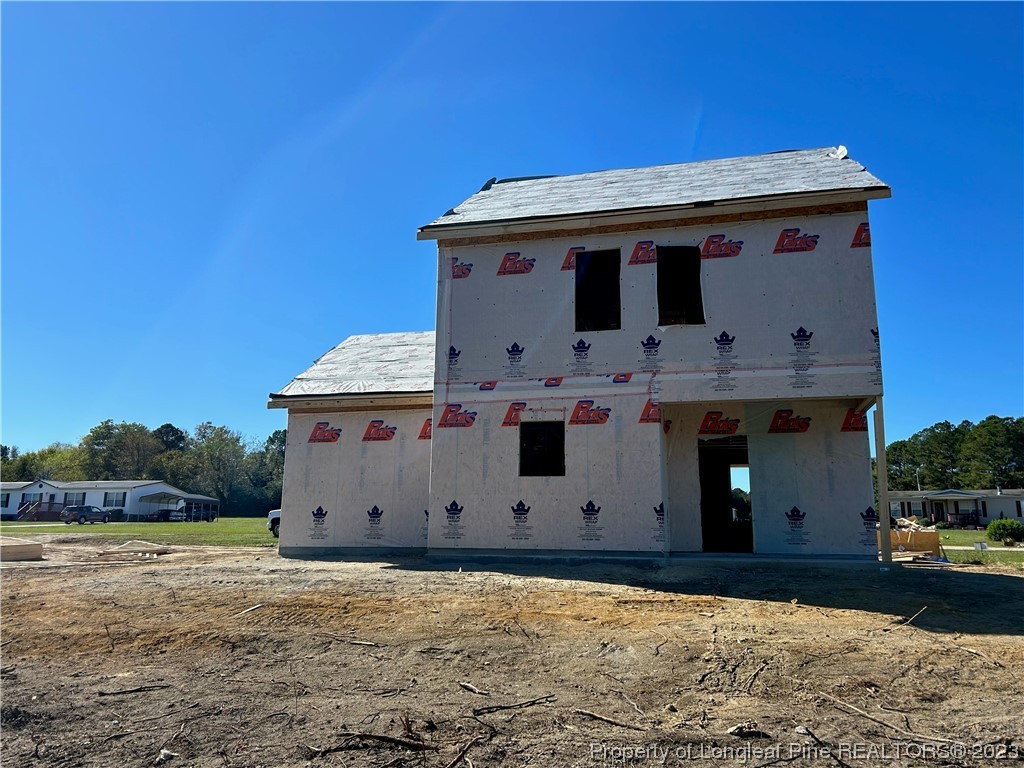 325 Ray Byrd Road Lillington, NC 27546 - Photo 4 of 23 a view of a house with a wooden fence