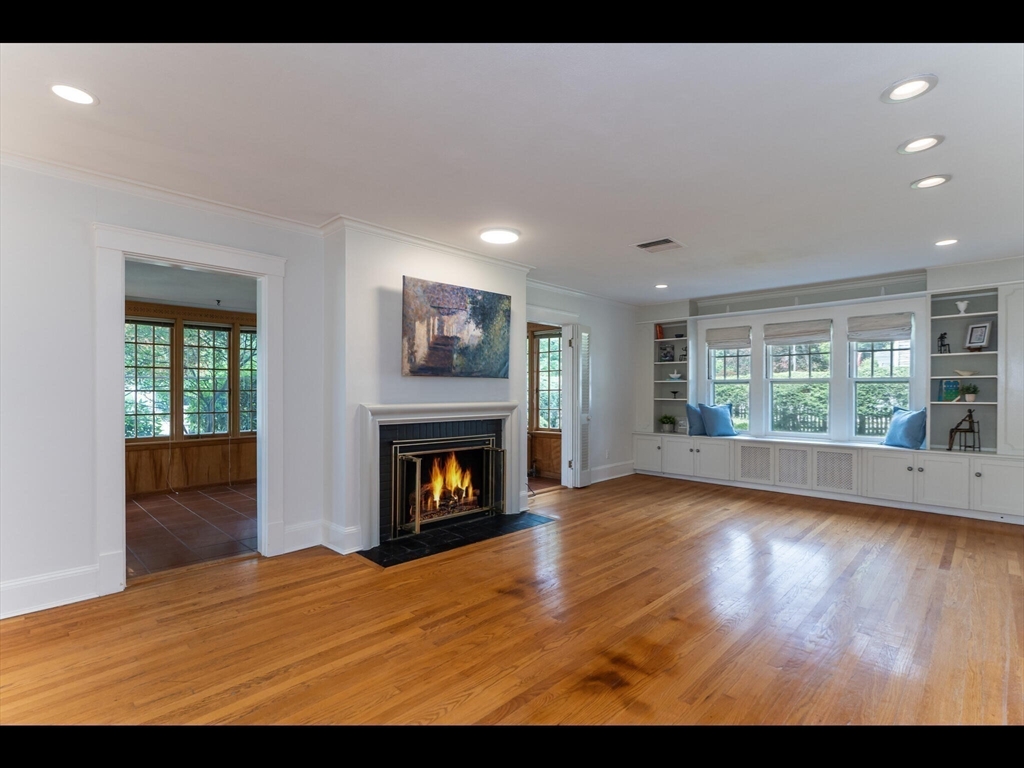 48 Hillcrest Avenue Longmeadow, MA 01106 - Photo 15 of 42 a view of empty room with wooden floor and fireplace