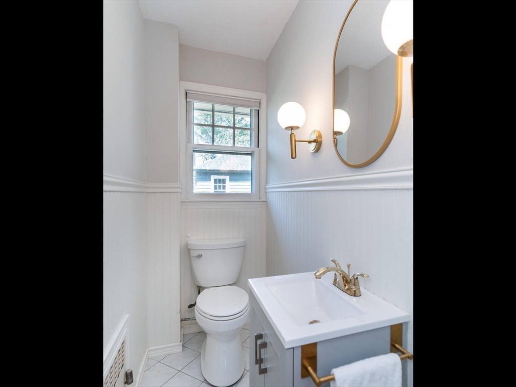48 Hillcrest Avenue Longmeadow, MA 01106 - Photo 19 of 42 a bathroom with a toilet a sink and mirror