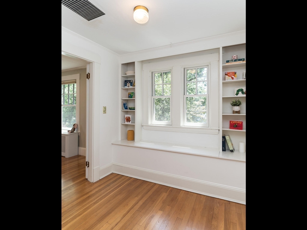 48 Hillcrest Avenue Longmeadow, MA 01106 - Photo 20 of 42 a view of an empty room with wooden floor and a window