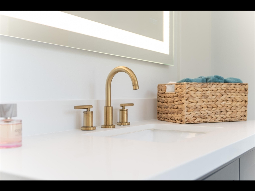 48 Hillcrest Avenue Longmeadow, MA 01106 - Photo 24 of 42 a view of cabinet with a close up of a sink