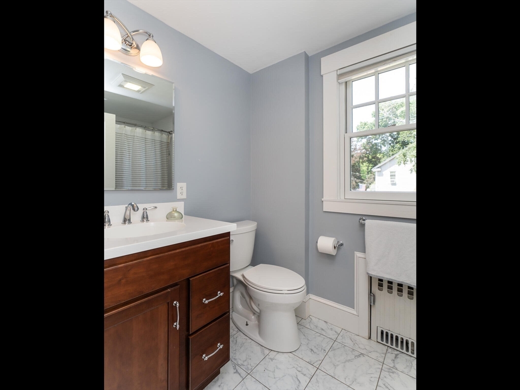 48 Hillcrest Avenue Longmeadow, MA 01106 - Photo 28 of 42 a bathroom with a sink a toilet and window