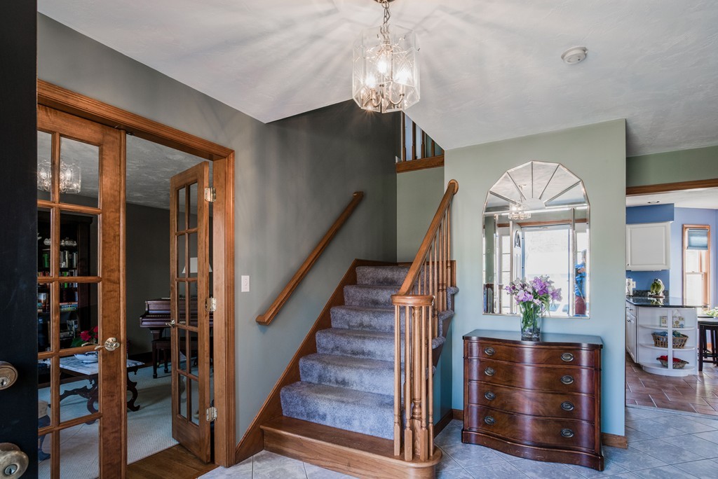 21 Russet Hill Road Ashland, MA 01721 - Photo 3 of 29 a view of hall way with furniture and chandelier