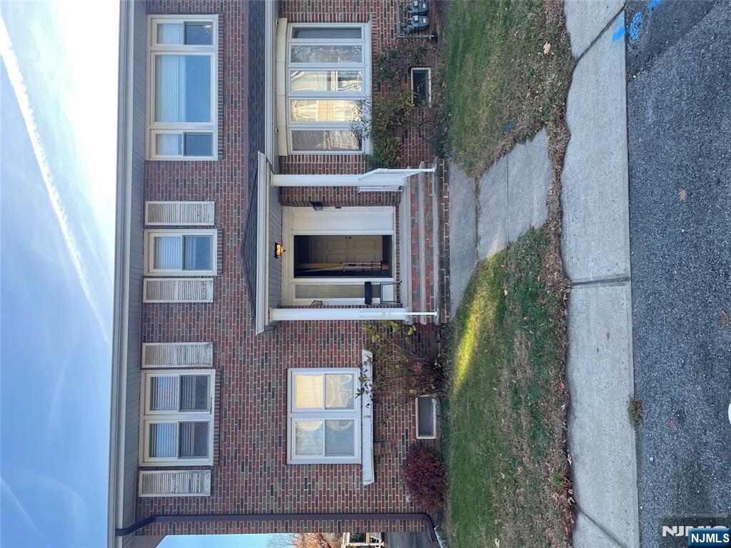113 Hawthorne Avenue Hawthorne, NJ 07506 - Photo 1 of 19 a front view of a house with garden