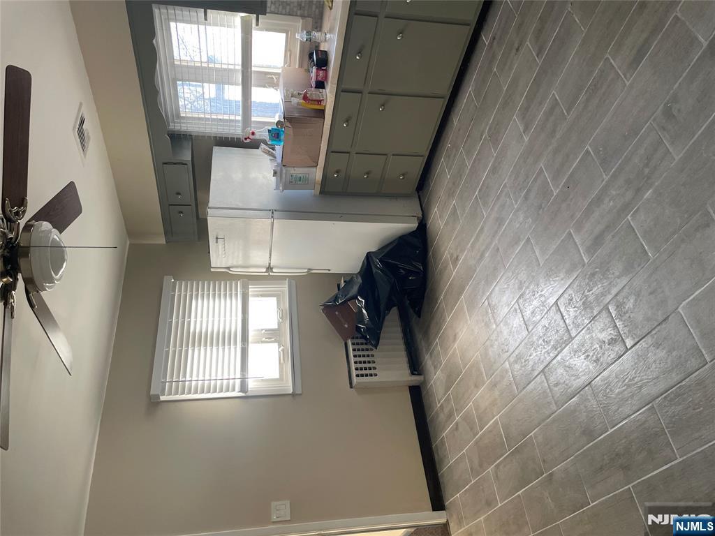 113 Hawthorne Avenue Hawthorne, NJ 07506 - Photo 16 of 19 a kitchen with refrigerator and window