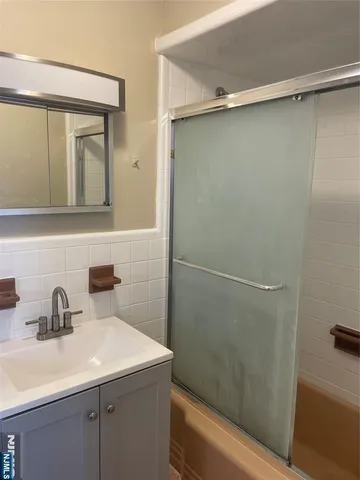 a bathroom with a sink and mirror