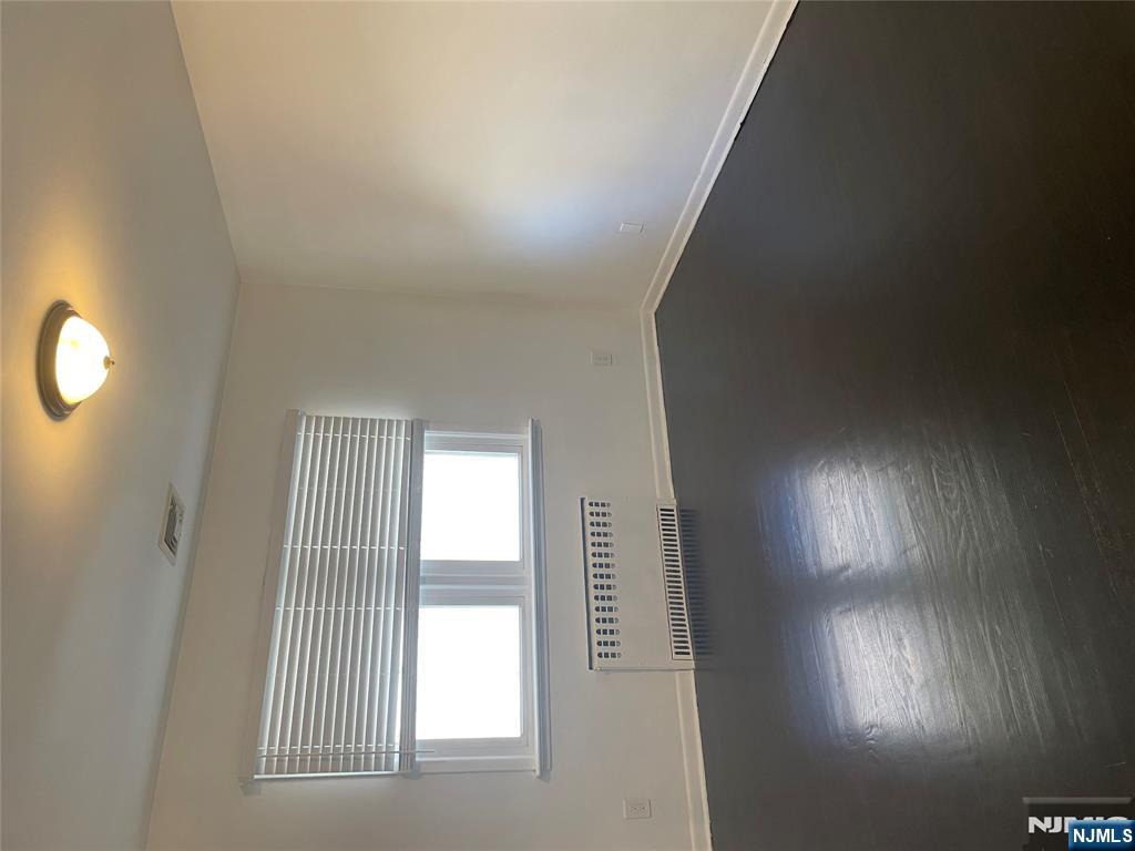 113 Hawthorne Avenue Hawthorne, NJ 07506 - Photo 9 of 19 an empty room with a window