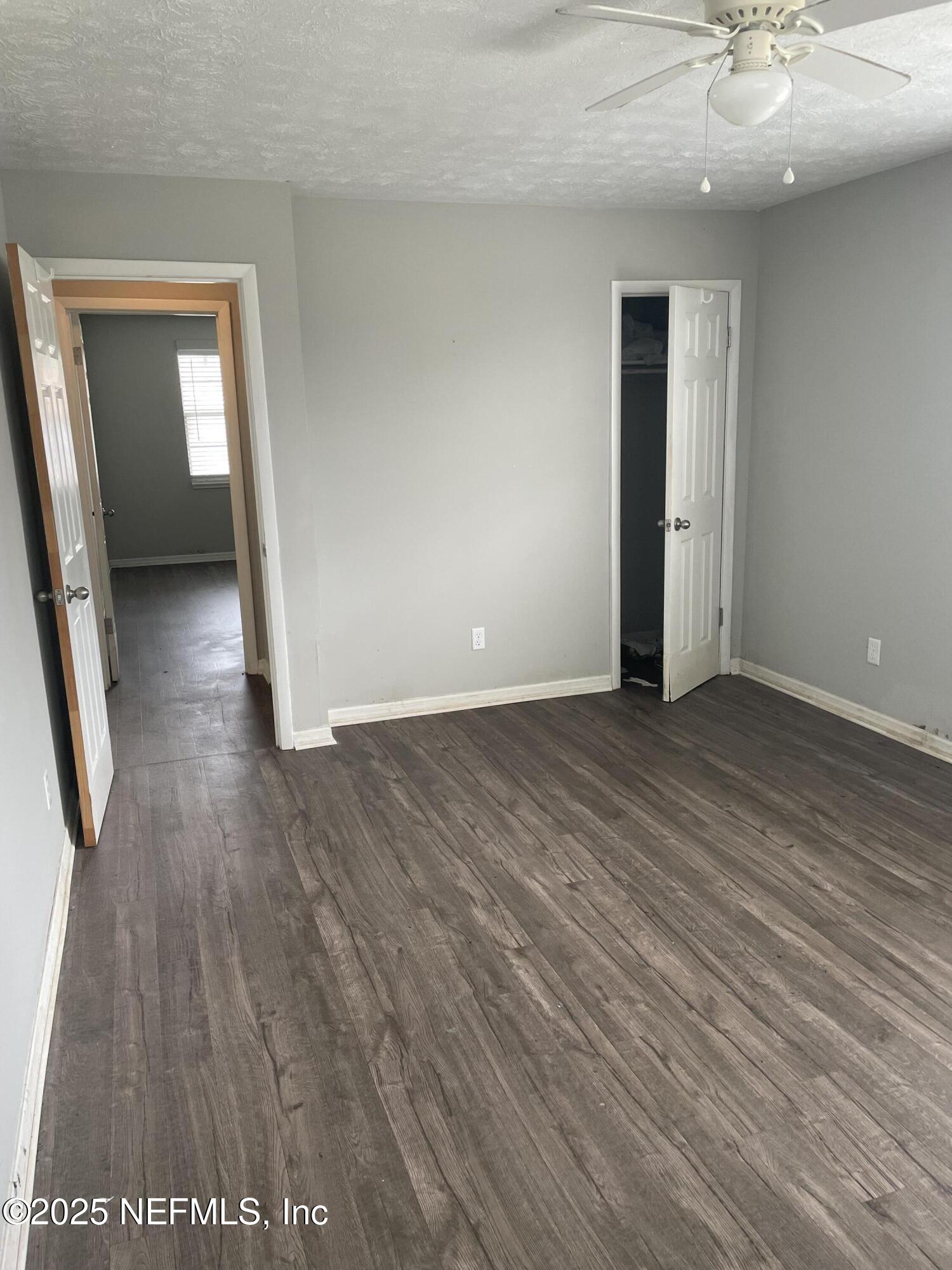 130 Gassett Road St. Augustine, FL 32080 - Photo 9 of 15 wooden floor in an empty room with a window