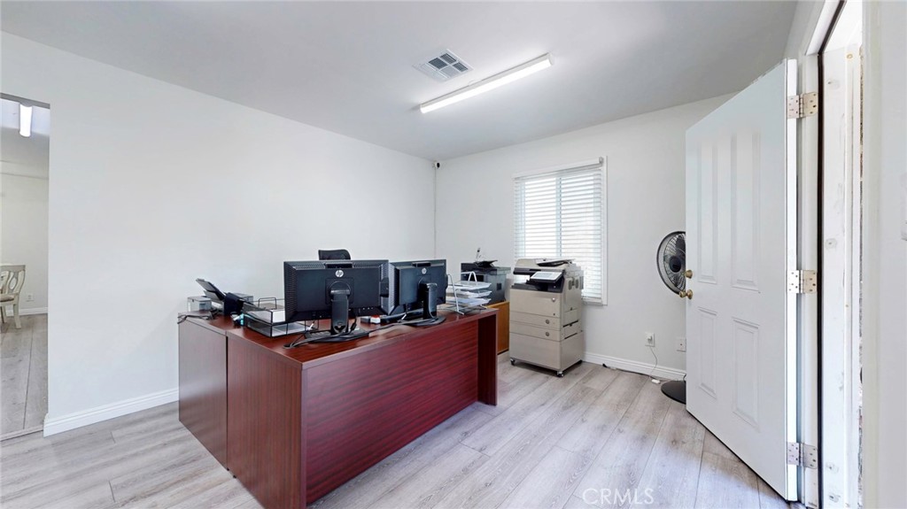 6851 Foothill Boulevard Tujunga, CA 91042 - Photo 13 of 50 a view of a workspace with furniture and wooden floor