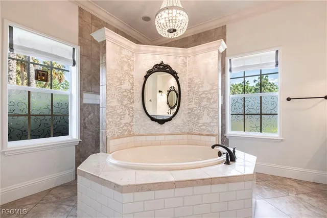 a bathroom with a bathtub and a window