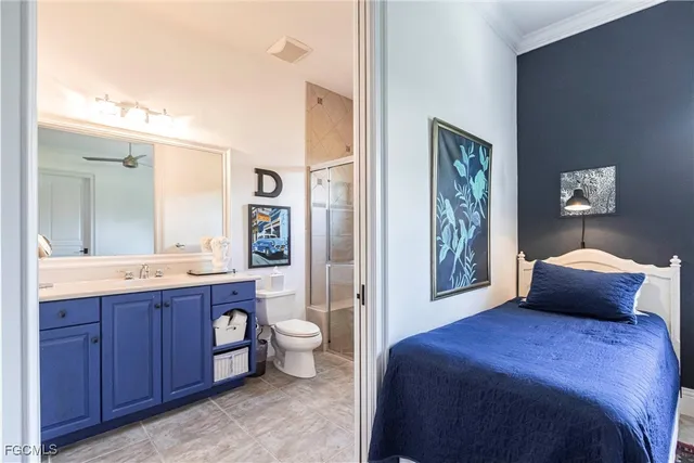 a bedroom with a bed and a bathroom