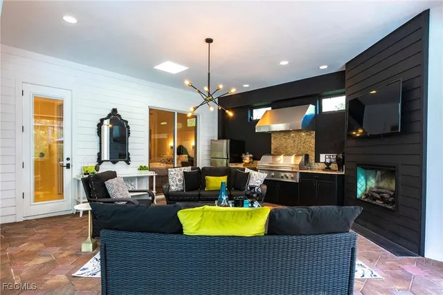 a living room with furniture fireplace and window