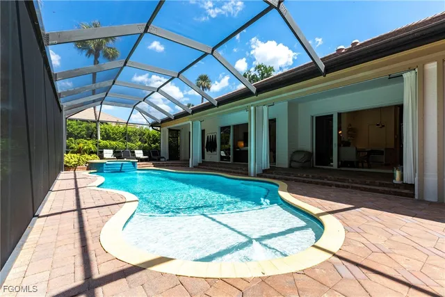 a view of a porch with a table and chairs