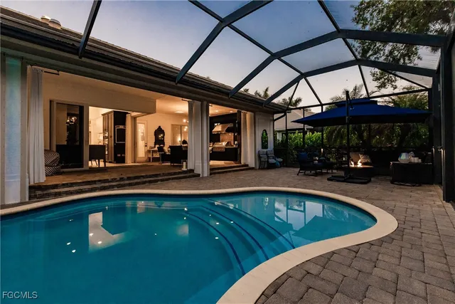 a view of a swimming pool with a patio