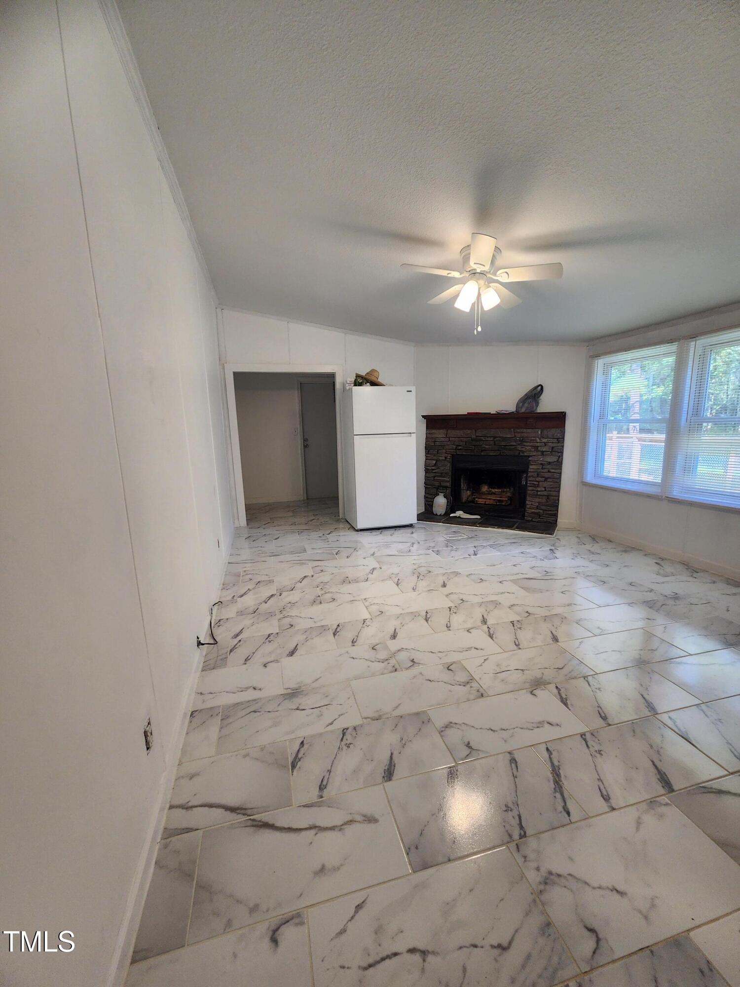 88 Barnes Road Middlesex, NC 27557 - Photo 15 of 18 a view of empty room with a fireplace