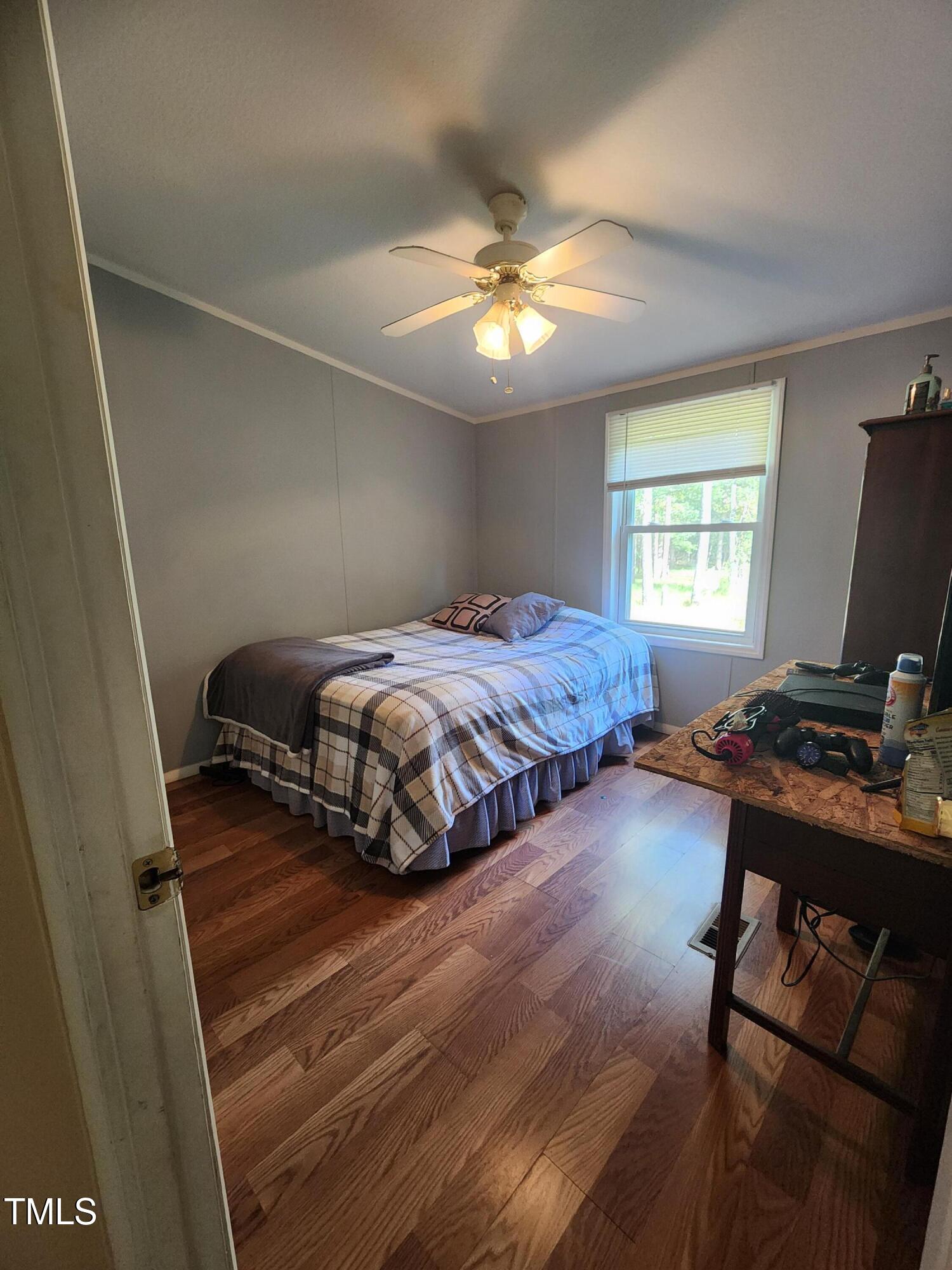 88 Barnes Road Middlesex, NC 27557 - Photo 6 of 18 a bedroom with a bed window and a desk