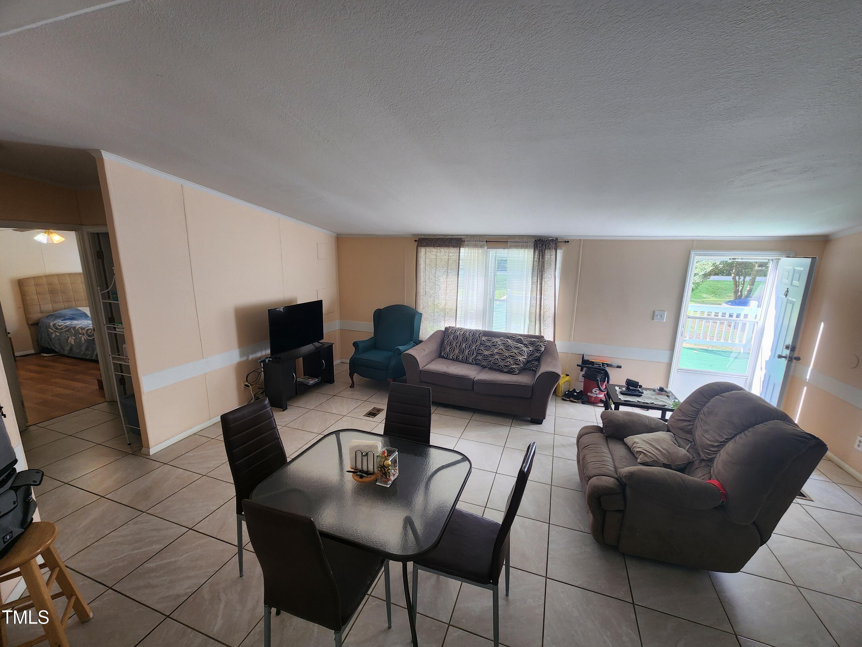 88 Barnes Road Middlesex, NC 27557 - Photo 8 of 18 a living room with furniture and a large window