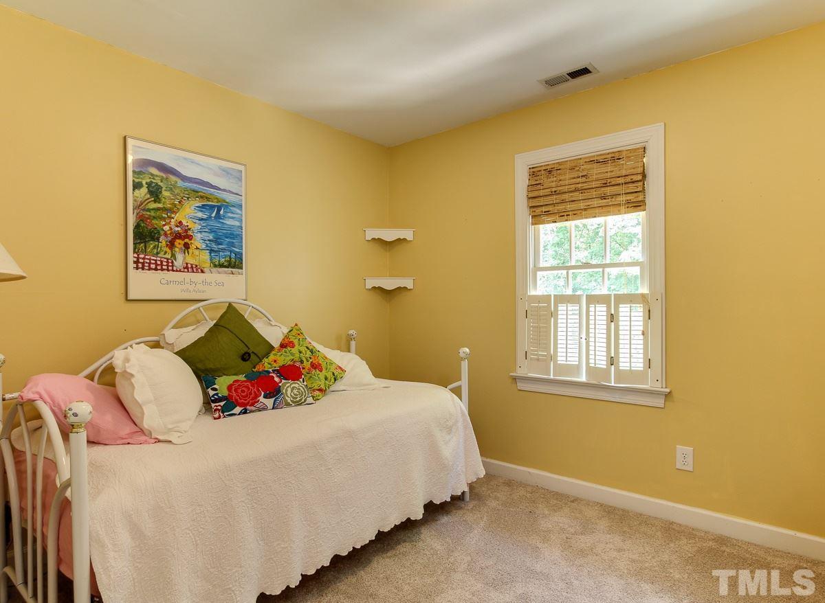4601 Wee Burn Trail Raleigh, NC 27612 - Photo 22 of 25 a bedroom with a bed and a window