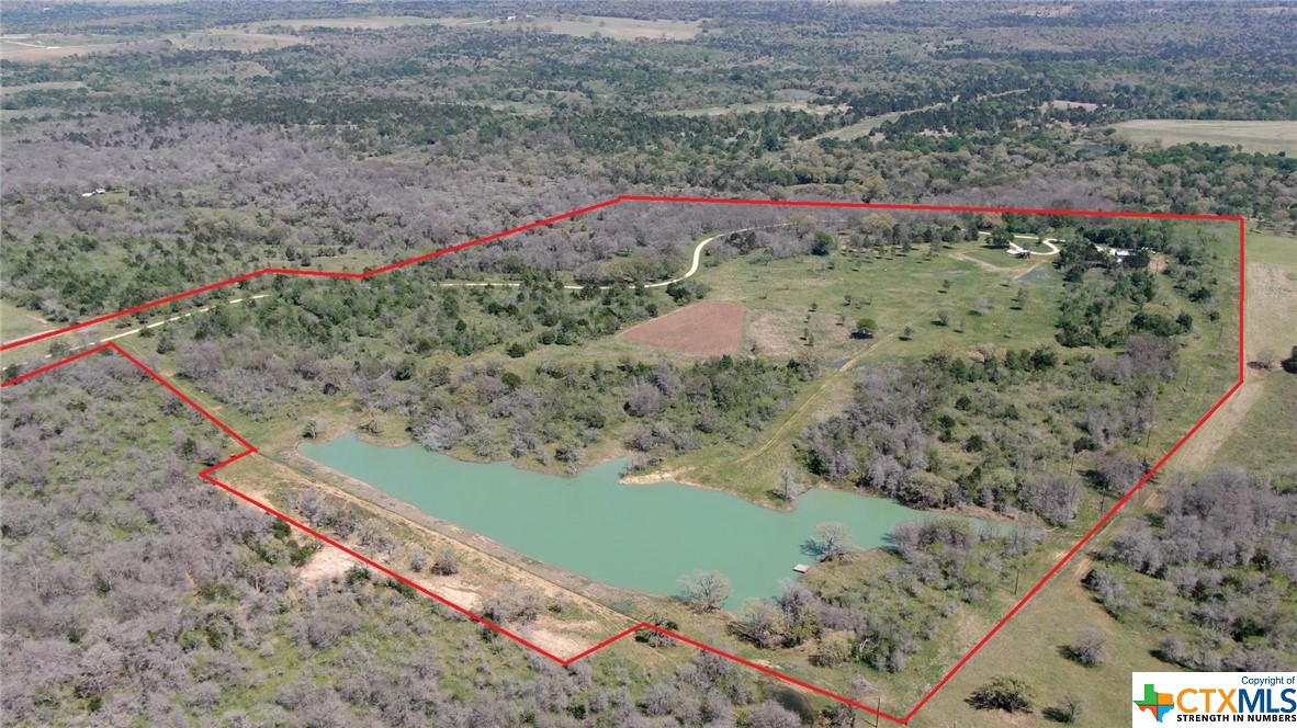 8550 Pettytown Road Red Rock, TX 78662 - Photo 1 of 1 a view of a pathway with a yard