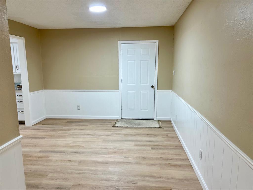 38 Valley View Circle Denison, TX 75021 - Photo 7 of 15 a view of a room with wooden floor