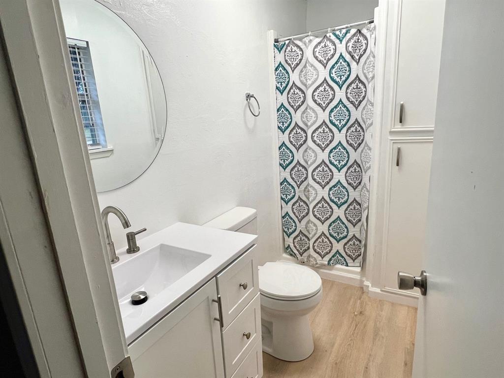 38 Valley View Circle Denison, TX 75021 - Photo 9 of 15 a white toilet sitting next to a bathroom sink