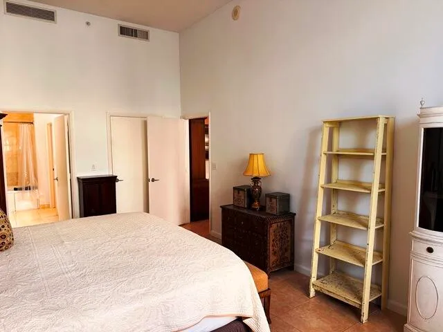 a bedroom with a bed and a closet