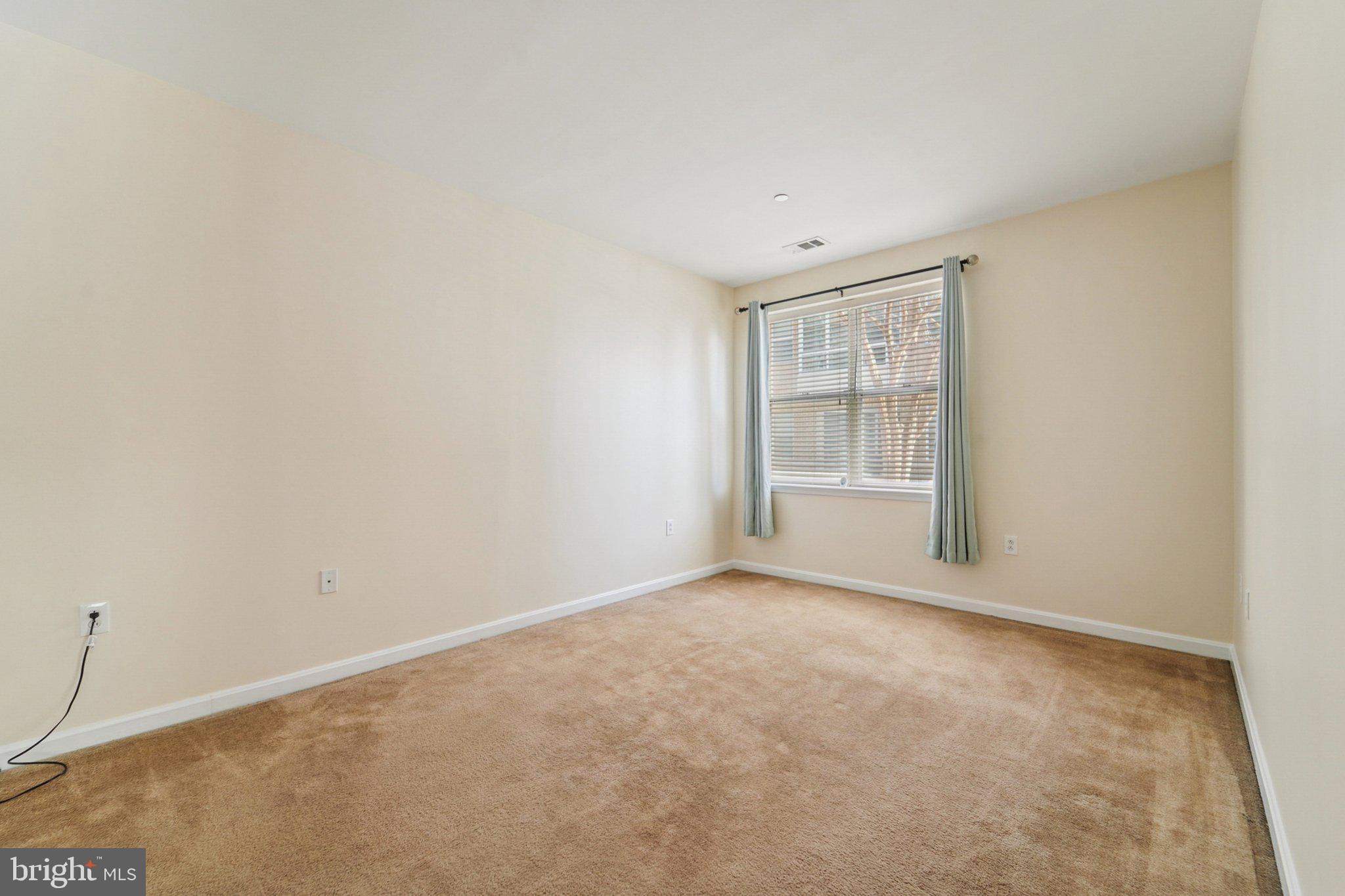 23 Pierside Drive, Unit 118 Baltimore, MD 21230 - Photo 20 of 32 a view of an empty room with a window