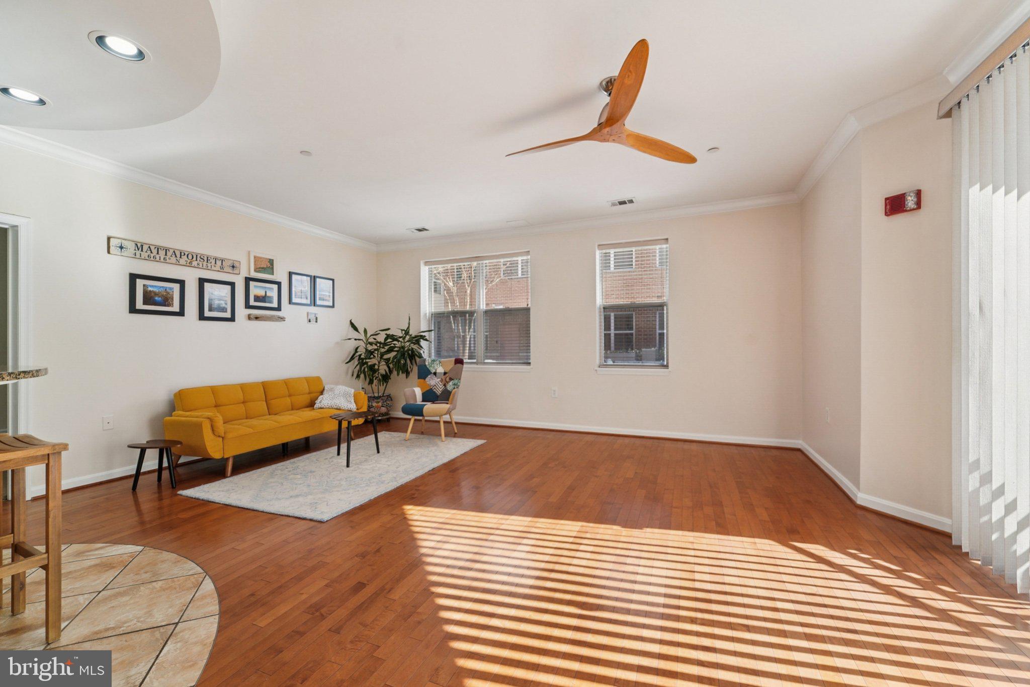 23 Pierside Drive, Unit 118 Baltimore, MD 21230 - Photo 9 of 32 a living room with furniture and wooden floor