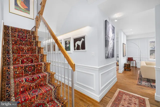 a living room with furniture and a rug