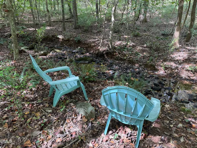 a view of a chairs in a backyard