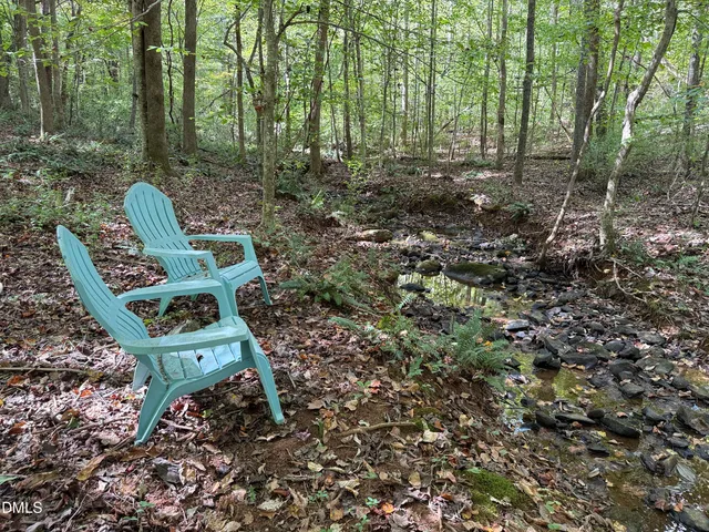 a garden view with a sitting space