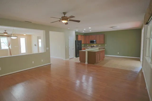 a view of a kitchen with a sink and a stove top oven