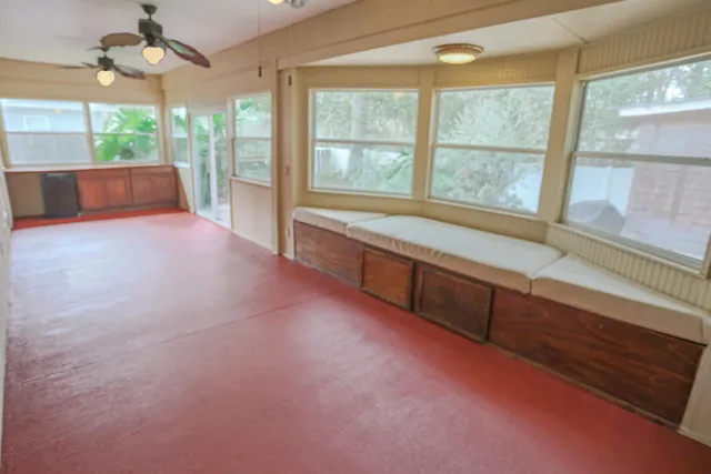 a large room with a large window and outdoor view