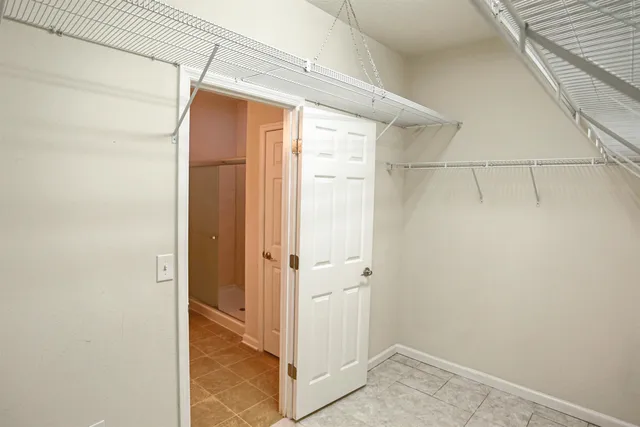 a bathroom with a glass shower door
