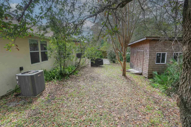 a backyard of a house with lots of green space