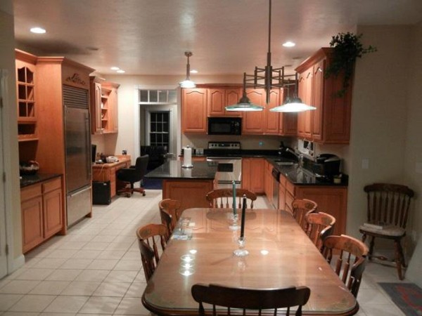 2 Fox Run Road Upton, MA 01568 - Photo 4 of 12 a kitchen with sink refrigerator dining table and chairs
