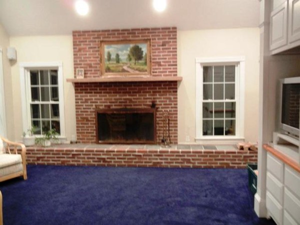 2 Fox Run Road Upton, MA 01568 - Photo 5 of 12 an empty room with a fireplace and window